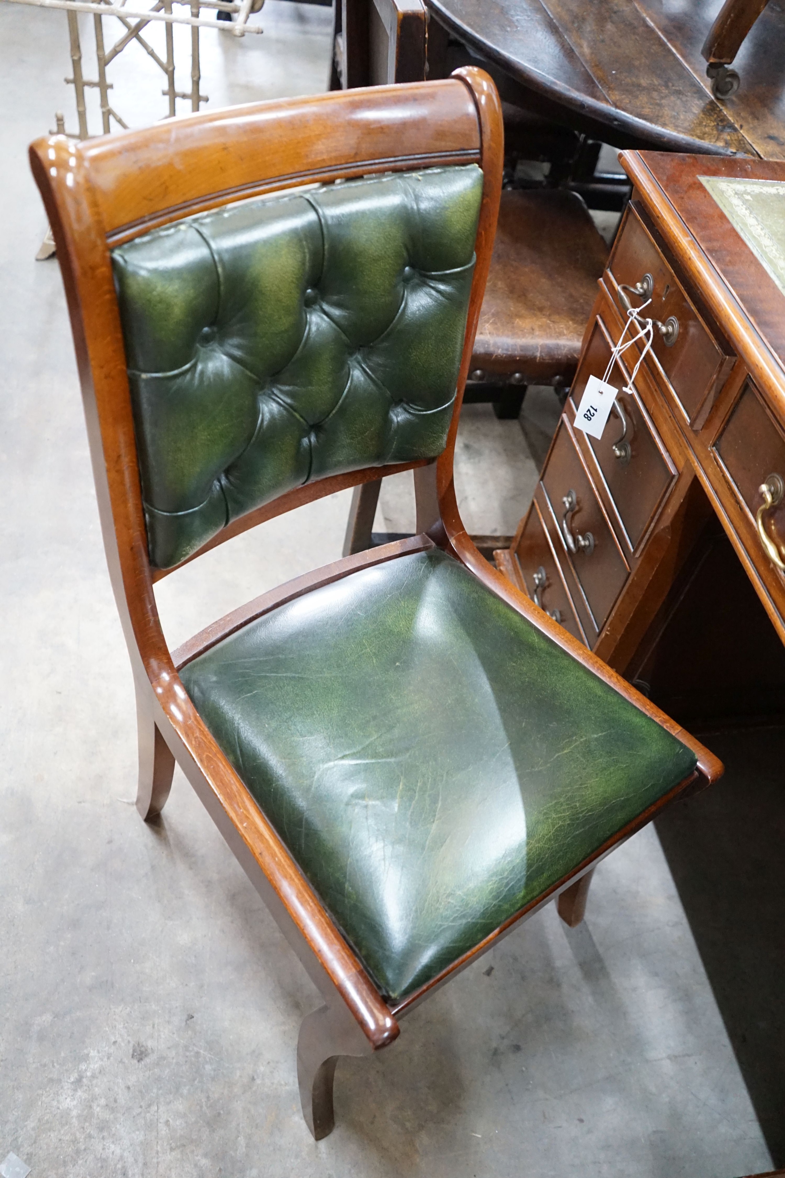 A reproduction mahogany pedestal desk, width 122cm, depth 60cm, height 77cm and chair